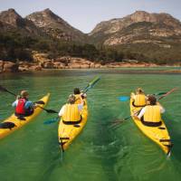 Kayaking the crystal clear waters of the Freycinet Peninsula on Cycle, Kayak and Walk Tasmania