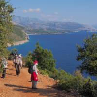 Hikers taking in the view on a southern Albanian coastal trail