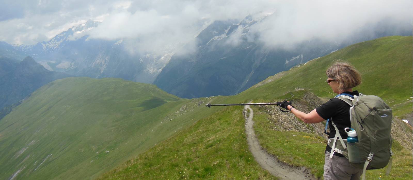 On the Mont de la Saxe route in Italy, opposite the Mont Blanc range, pointing down to Courmayeur, still many hours ridge-walking away. |  <i>Jeremy Bourke</i>