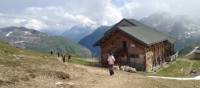 Hikers descending to the Bonhomme Refuge in the French Alps | Kate Baker