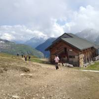 Hikers descending to the Bonhomme Refuge in the French Alps | Kate Baker