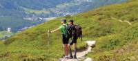 Trekkers taking in the spectacular surroundings of the European Alps | Erin Williams