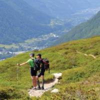 Trekkers taking in the spectacular surroundings of the European Alps | Erin Williams
