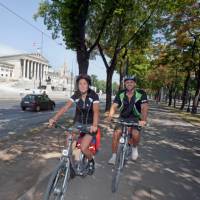 Cycling past Parliament in Vienna