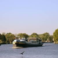 The MS Gandalf sailing the waterways past scenic landscapes