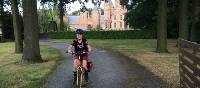 Young cyclist outside a castle near Ghent | Hilary Delbridge