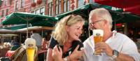 A happy couple enjoying their holiday in Bruges.