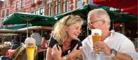 A happy couple enjoying their holiday in Belgium.