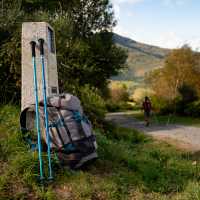 Backpack and walking poles on the Camino