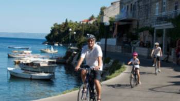 Cycling past boats on the Croatian islands with kids | Ross Baker