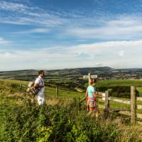 Walkers following the South Downs Way in East Sussex. | Andrew Pickett