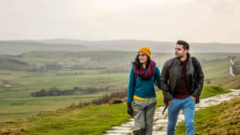 A happy couple following the Pennine Way trail in Derbyshire. | Andrew Pickett