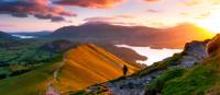 A hiker admiring the breathtaking views along the Cumbria Way. | John Finney