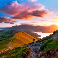 A hiker admiring the breathtaking views along the Cumbria Way. | John Finney