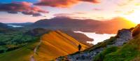 A hiker admiring the breathtaking views along the Cumbria Way. | John Finney