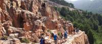 The sun shining down a group in mountainous Corsica | Paul Ensor