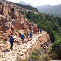 The sun shining down a group in mountainous Corsica | Paul Ensor