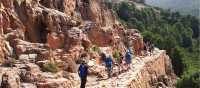 The sun shining down a group in mountainous Corsica | Paul Ensor