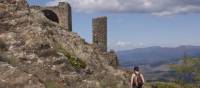 Walkers appraoching a Cathar Castle