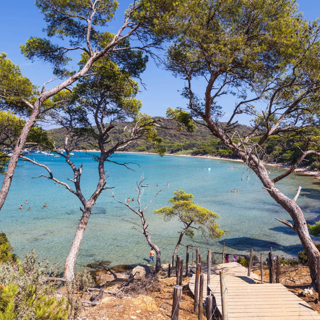 Enjoying secluded swims on a beach in Porquerolles island along the French Riviera