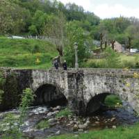 Pilgrims crossing the UNESCO listed bridge at St Chely d'Aubrac | Rob Mills