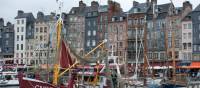 The harbour of Honfleur with its narrow houses and array of boats | Kate Baker