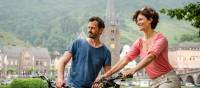 Couple cycling along the Moselle River | Günter Standl