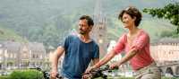 Couple cycling along the Moselle River | Günter Standl