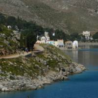 Cyclists near to the delightful town of Symi, Greece