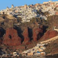 Sunset falls on the village of Oia on the Greek Island of Santorini | Brad Atwal