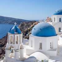 Experience the famous white-washed buildings and blue-domed churches of Santorini.