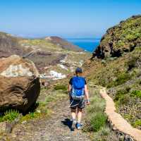 Follow the mountain road to Oia on Santorini and take in the famous blue-domed churches, and whitewashed houses.