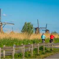 Cycle by windmills in the Kinderdijk