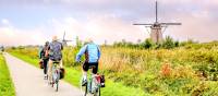 Cycling past windmills in Holland