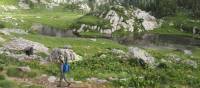 Walking past rugged mountainside on the Monte Rosa Alpine Walk