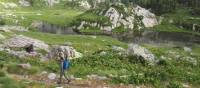 Walking past rugged mountainside on the Monte Rosa Alpine Walk