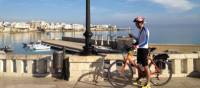 Cyclist on waterfront in Otranto | Kate Baker