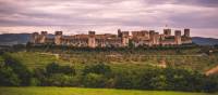 The walled town of Monteriggioni sits dramatically in the Tuscan landscape | Tim Charody