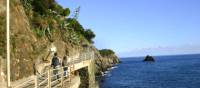 Hikers along the seaside trail on the Cinque Terre