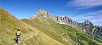 Hiker on a dramatic trail in the Val Maira