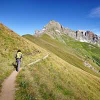 Hiker on a dramatic trail in the Val Maira