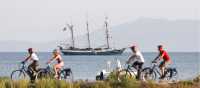 Cycling past the sailboat in Tuscany