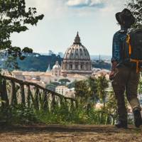 Pilgrim walking into St Peters in Rome at the end of the Via Francigena | Tim Charody