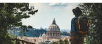 Pilgrim walking into St Peters in Rome at the end of the Via Francigena | Tim Charody