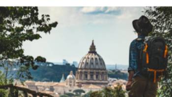 Pilgrim walking into St Peters in Rome at the end of the Via Francigena | Tim Charody