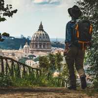 Pilgrim walking into St Peters in Rome at the end of the Via Francigena | Tim Charody