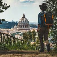 Pilgrim walking into St Peters in Rome at the end of the Via Francigena | Tim Charody