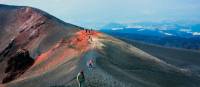 Walking up to the volcanic summit of Mount Etna in Italy