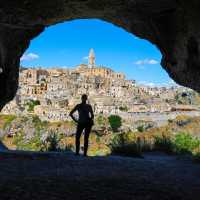 The view of Matera from inside a cave at Murgia National Park