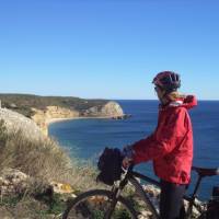 Cyclist admiring the coastline on day 5 of the Algarve Cycle